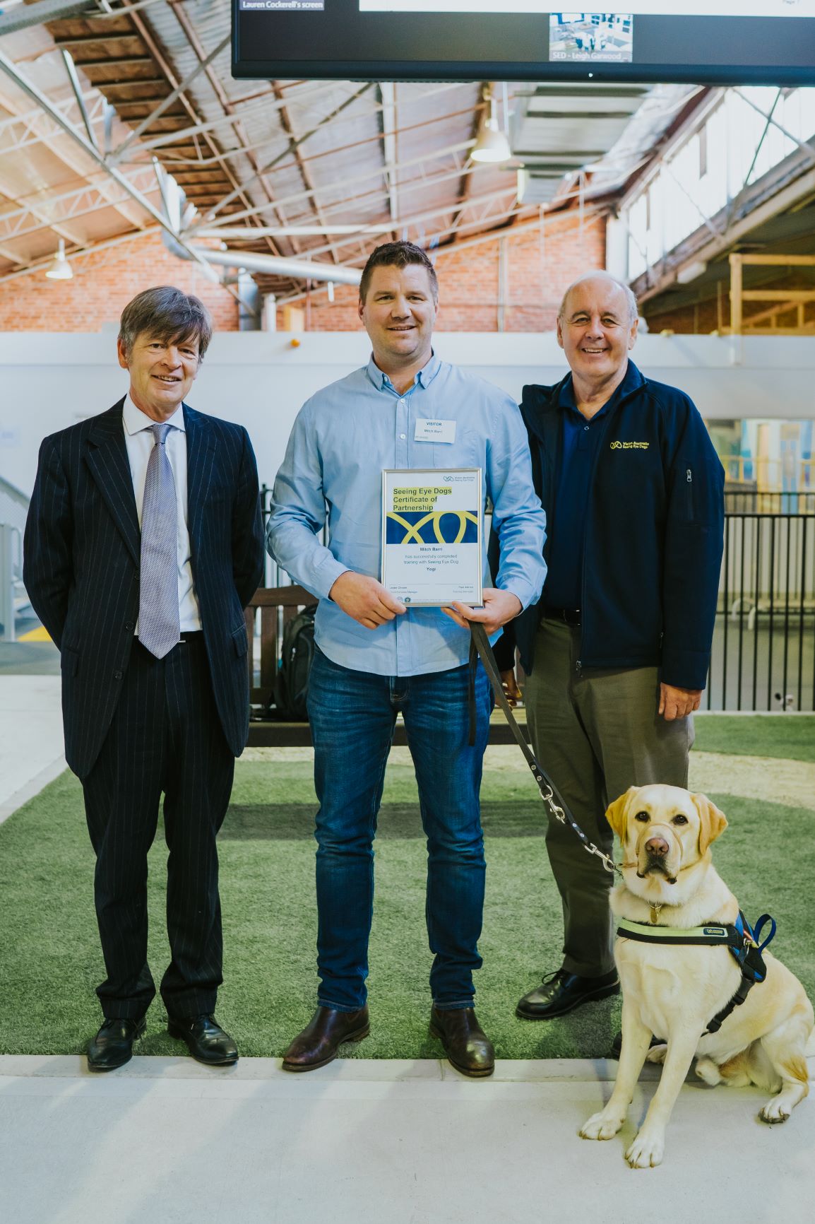 L TO R: The Hon. Luke Donnellan, Minister for Child Protection, Disability, Ageing and Carers, Mitch holding his certificate, Vision Australia CEO Ron Hooton, SED Yogi